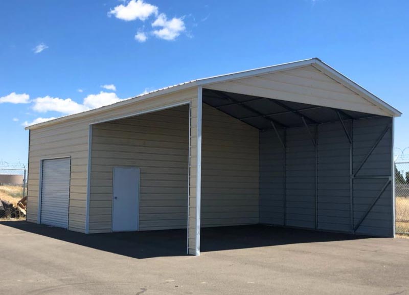 An expansive beige steel combo building showcasing a large open-air vehicle shelter integrated with an enclosed storage room featuring a roll-up garage door and a white walk-in entry door.