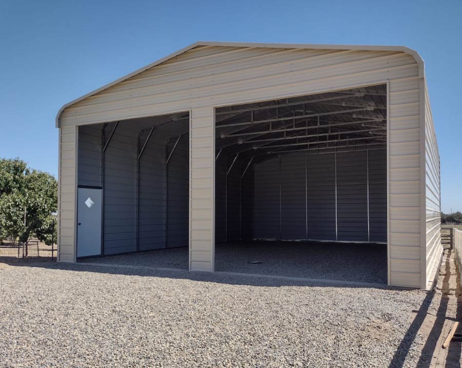 High-clearance open steel utility carport structure next to a brown storage container unit with a rolling shutter door.